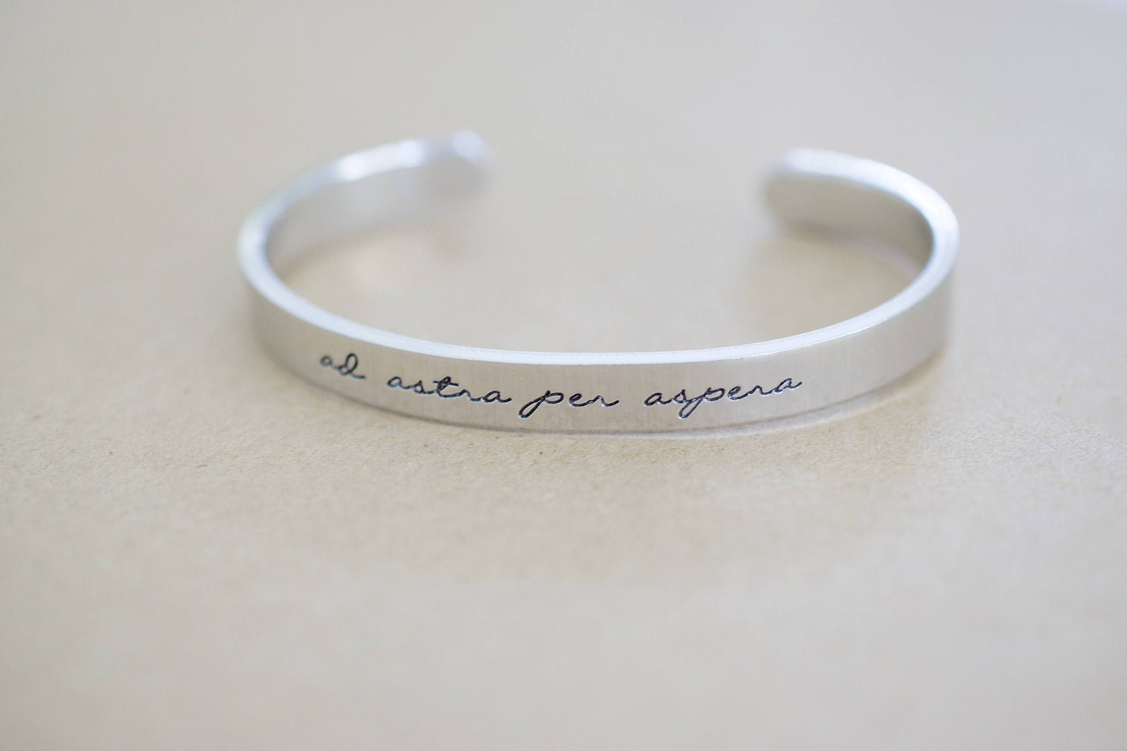 Ad Astra Per Aspera Bracelet | Latin Cuff Bracelet, displayed laying flat