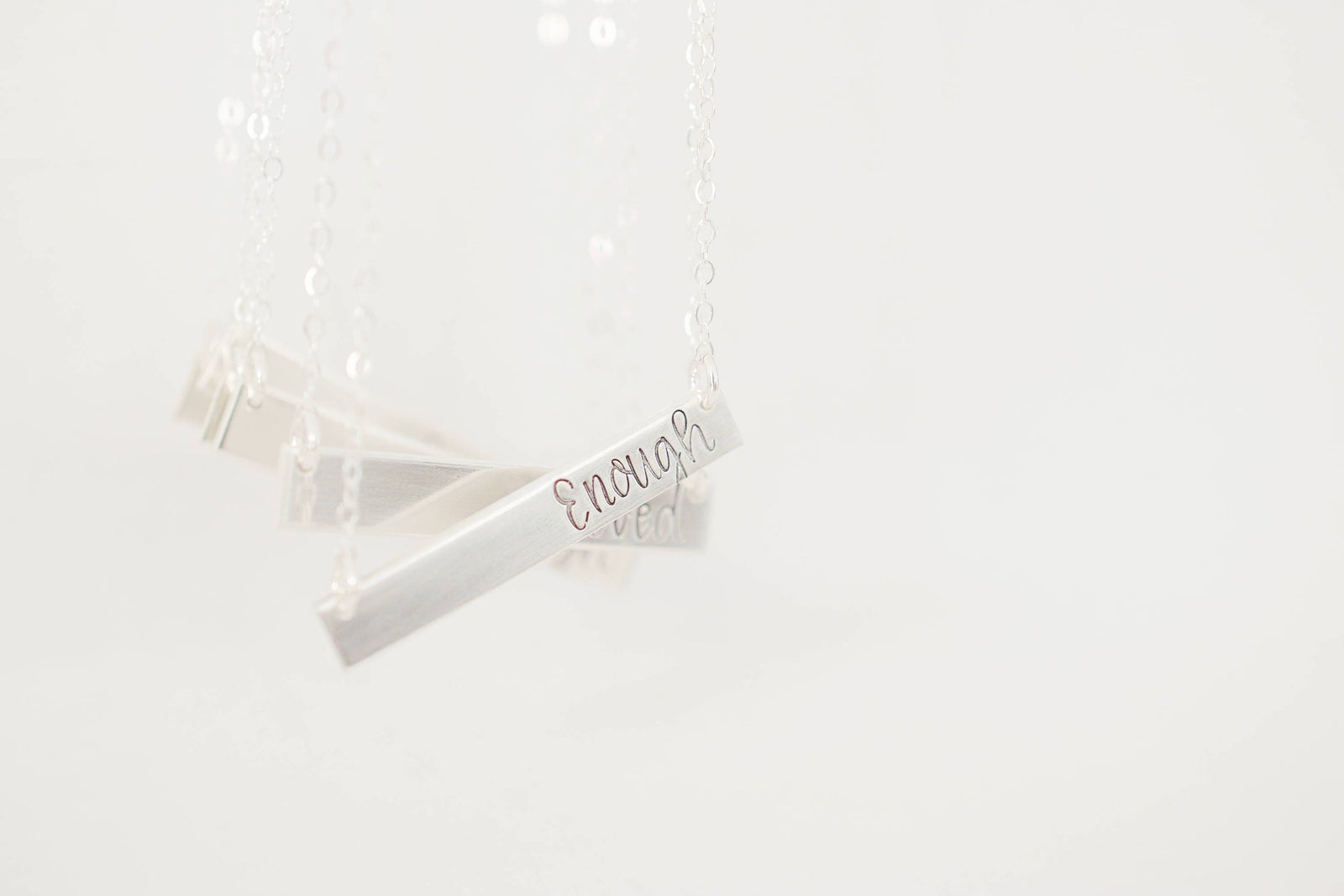 Enough Bar Necklace, hanging view