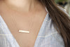 Roman Numeral Bar Necklace, close up on neck