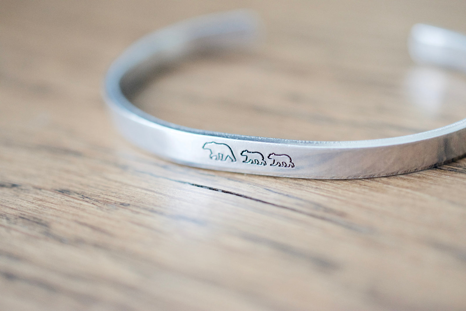 Mama Bear Bracelet, wood background