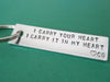 I Carry Your Heart Keychain with Initials, on a green background