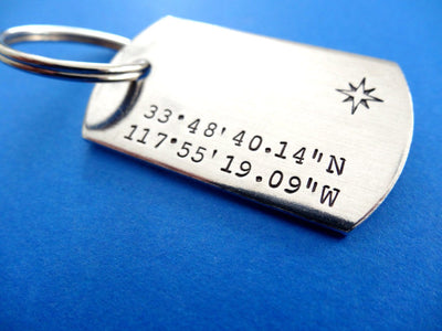 Coordinates Dog Tag Keychain | Custom Stamped Keychains, on blue background